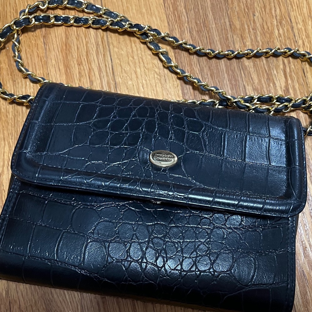 Ladies American Tourister blue bag with gold chain,size 7" H X 8 1/2 L X 2 1/2"